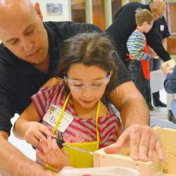 Picture of man and child at Carpenter union free workshop